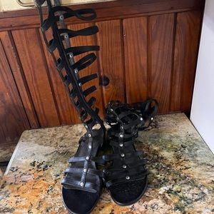 Stuart Weltzmen flat strappy to the knee “ boot “